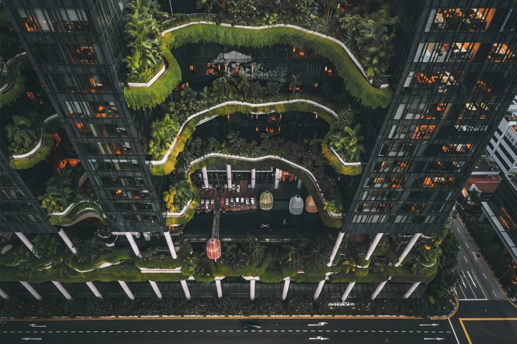 Parkroyal Collection Pickering hotel in Singapore — eco‑friendly architecture with lush sky gardens and cascading greenery integrated into high‑rise design.