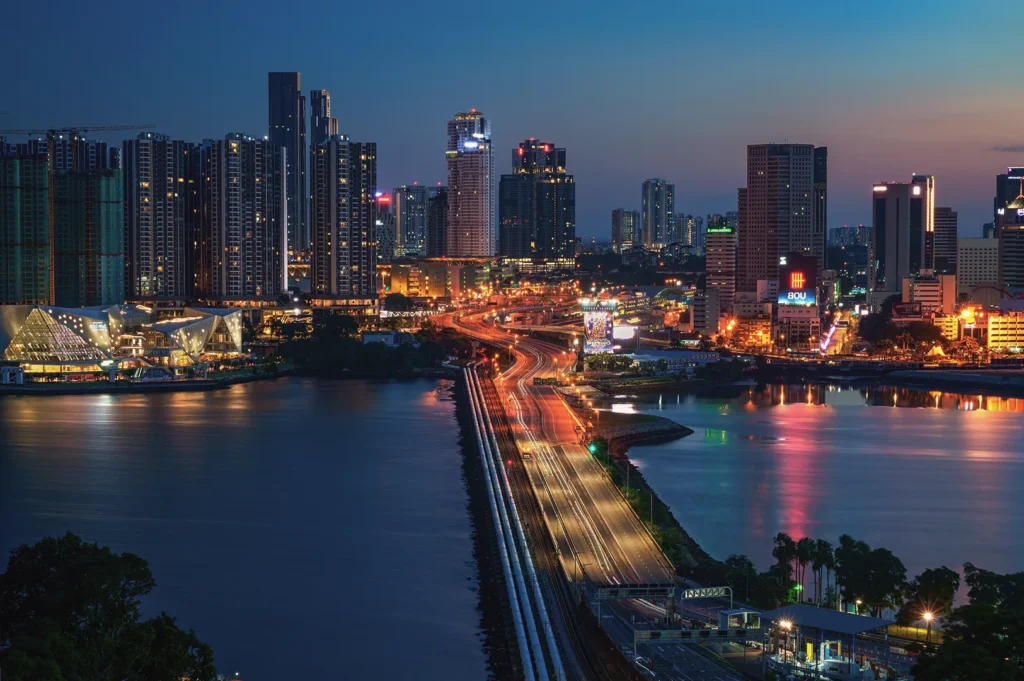 Night skyline of Johor Bahru city and the Causeway connecting Singapore and Malaysia over the Straits of Johor.